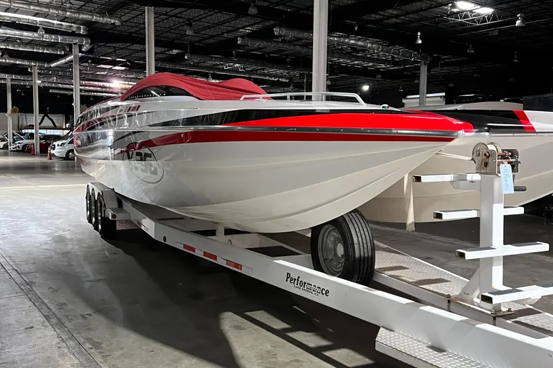  Yacht Photos Pics 2004 Spectre 36 Cat powerboat on trailer in warehouse, red and white design.