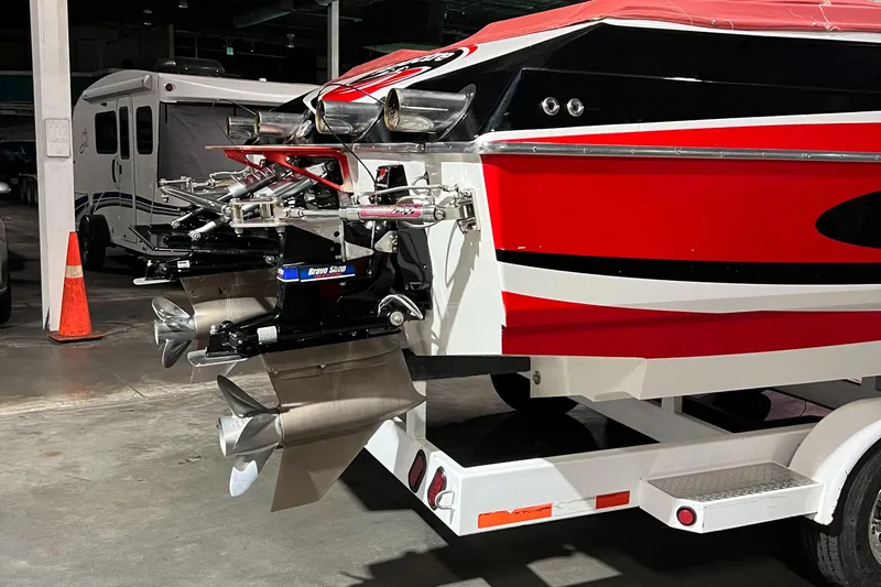  Yacht Photos Pics 2004 Spectre 36 Cat boat with vibrant red and black design, parked indoors.