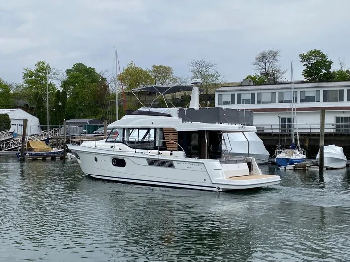  Yacht Photos Pics 2026 Beneteau 41 Swift Trawler FLY cruising in a marina setting.