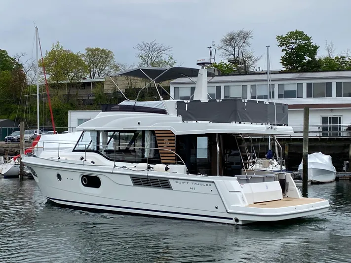  Yacht Photos Pics 2026 Beneteau 41 Swift Trawler FLY docked in a marina.