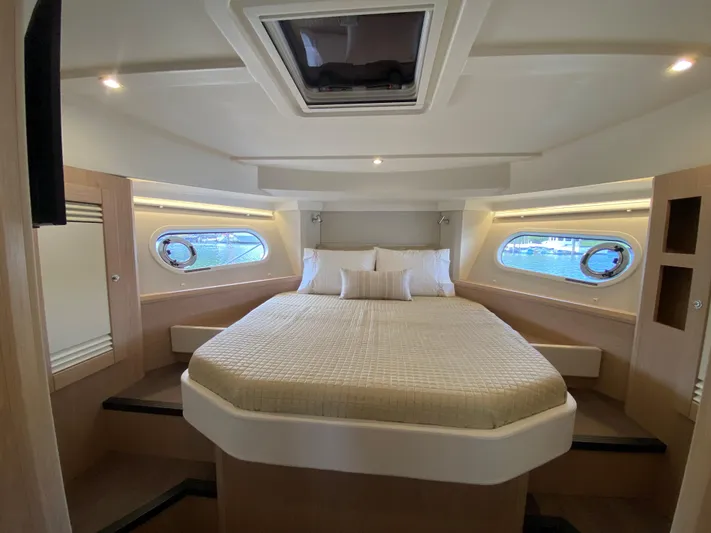  Yacht Photos Pics Luxurious cabin interior of 2026 Beneteau 41 Swift Trawler FLY with skylight and portholes.