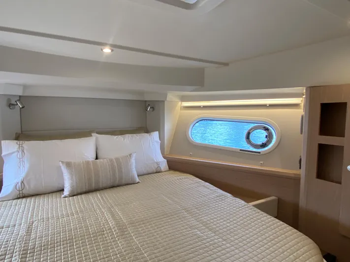  Yacht Photos Pics Luxurious bedroom interior of 2026 Beneteau 41 Swift Trawler FLY with ocean view.