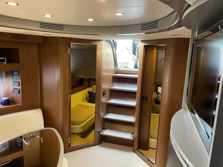  Yacht Photos Pics Luxurious interior of a 2012 Riva Rivale yacht with modern wood finishes and elegant design.