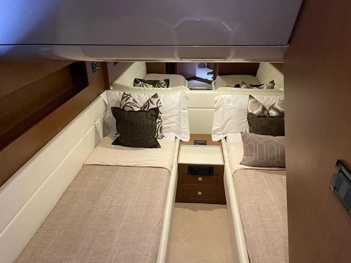  Yacht Photos Pics Luxurious 2012 Riva Rivale yacht cabin with twin beds and elegant decor.