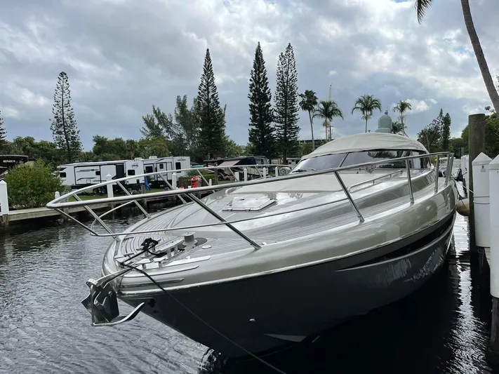  Yacht Photos Pics Luxury 2012 Riva Rivale yacht docked by palm trees and RVs.