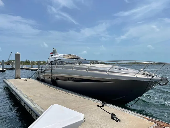  Yacht Photos Pics Luxury 2012 Riva Rivale yacht docked at marina under clear blue sky.