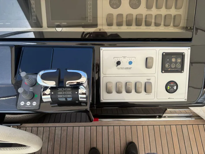  Yacht Photos Pics Control panel of a 2012 Riva Rivale yacht with sleek design and modern controls.