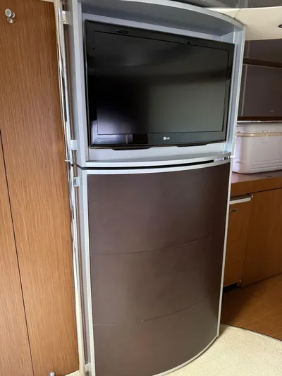  Yacht Photos Pics 2012 Riva Rivale interior with mounted LG TV and modern cabinetry.