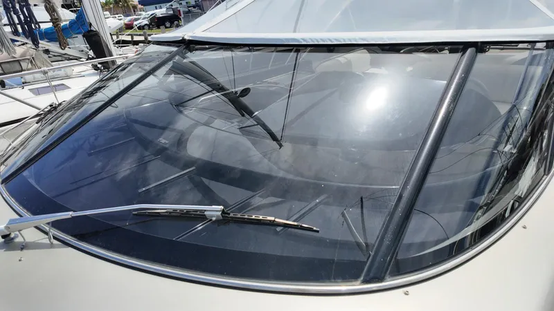  Yacht Photos Pics Close-up of a 2012 Riva Rivale yacht windshield with wipers in a marina.