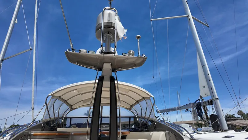  Yacht Photos Pics 2012 Riva Rivale yacht with sails against a clear blue sky.