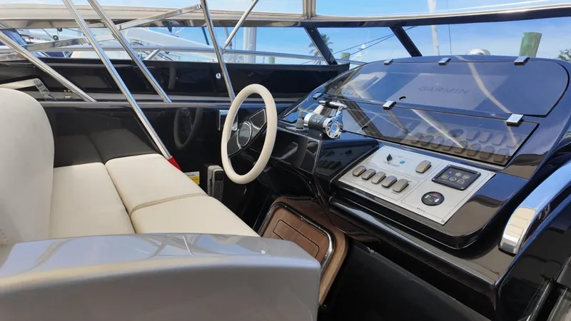  Yacht Photos Pics Luxurious 2012 Riva Rivale yacht cockpit with sleek controls and comfortable seating.