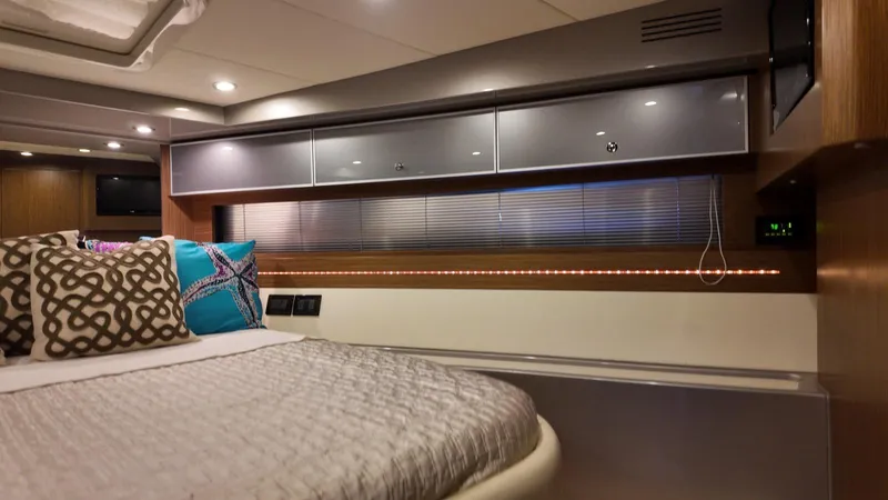  Yacht Photos Pics Luxurious interior of a 2012 Riva Rivale yacht cabin with modern decor and ambient lighting.