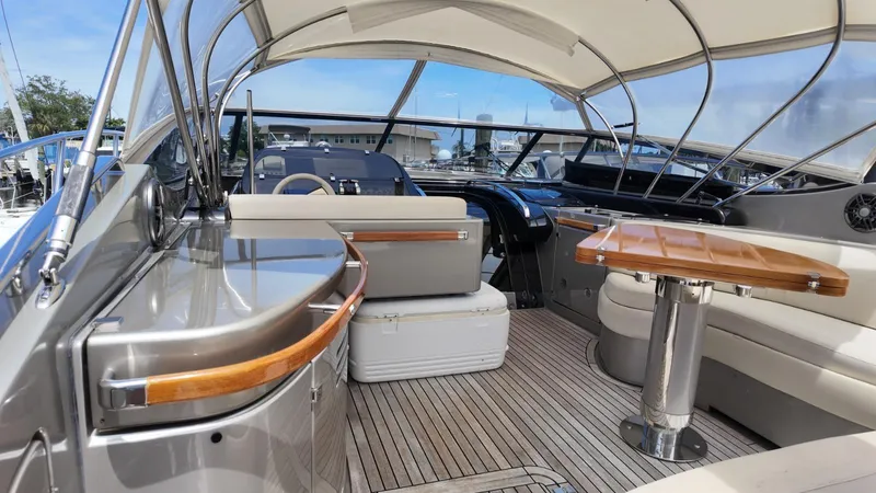  Yacht Photos Pics Luxurious 2012 Riva Rivale yacht interior with elegant seating and polished wood accents.
