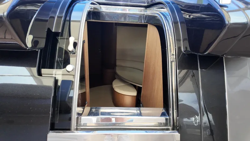  Yacht Photos Pics 2012 Riva Rivale yacht interior entrance with sleek design and wooden accents.