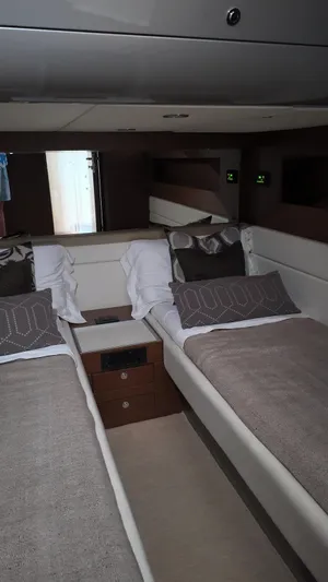  Yacht Photos Pics Luxurious 2012 Riva Rivale yacht cabin with twin beds and elegant decor.