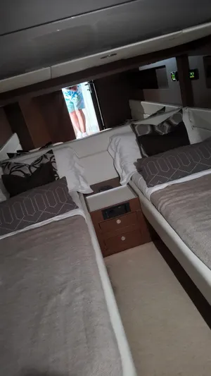  Yacht Photos Pics Interior of 2012 Riva Rivale yacht with twin beds and modern decor.