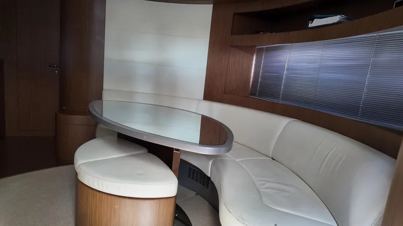  Yacht Photos Pics Luxurious interior of a 2012 Riva Rivale yacht with elegant seating and table.