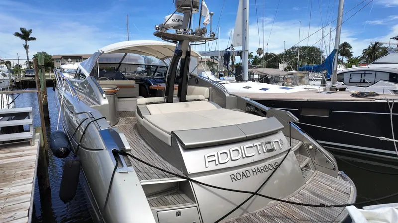  Yacht Photos Pics Luxury 2012 Riva Rivale yacht docked at marina, featuring sleek design and spacious deck.