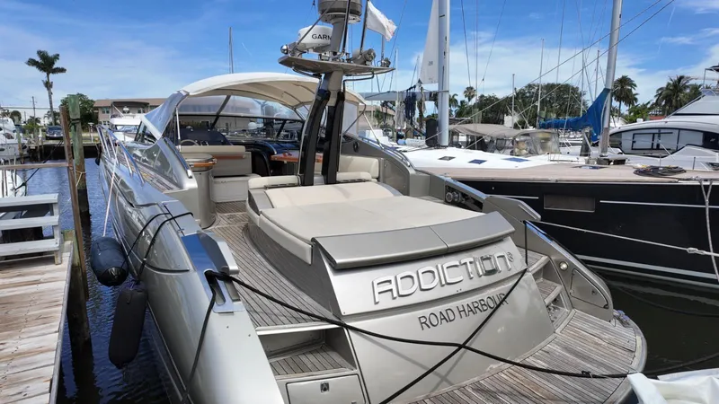  Yacht Photos Pics Luxury 2012 Riva Rivale yacht docked at marina, featuring sleek design and spacious deck.