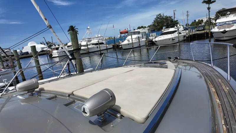  Yacht Photos Pics Luxury 2012 Riva Rivale yacht docked at marina, surrounded by other boats under clear blue sky.
