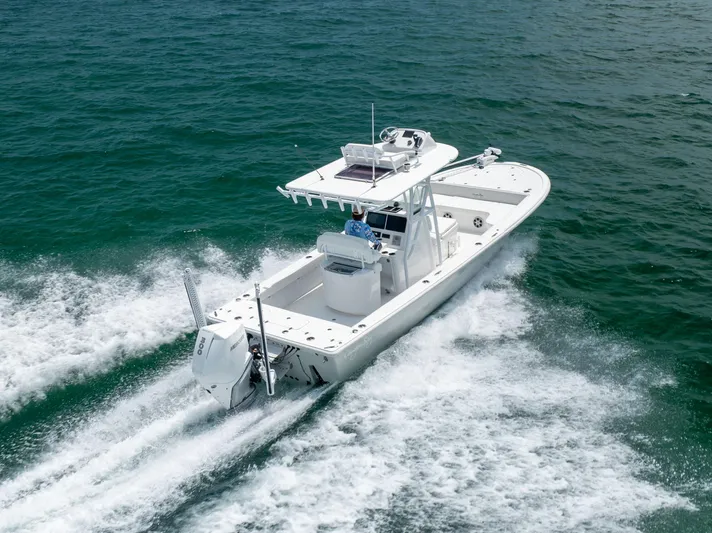  Yacht Photos Pics 2023 Canyon Bay 28h boat cruising on open water, showcasing sleek design and powerful performance.