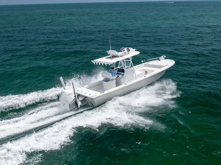  Yacht Photos Pics 2023 Canyon Bay 28h boat cruising on open ocean waters.