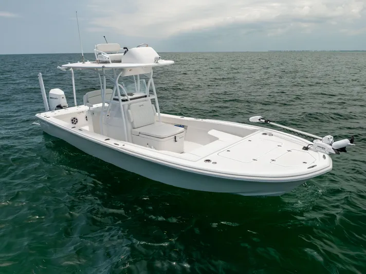  Yacht Photos Pics 2023 Canyon Bay 28h boat on open water under cloudy sky.