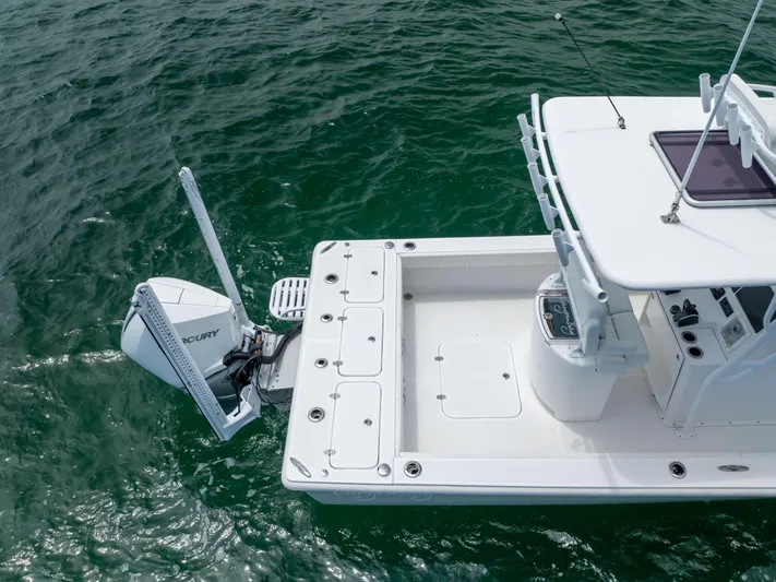  Yacht Photos Pics Canyon Bay 28h 2023 boat on water, featuring spacious deck and powerful outboard motor.