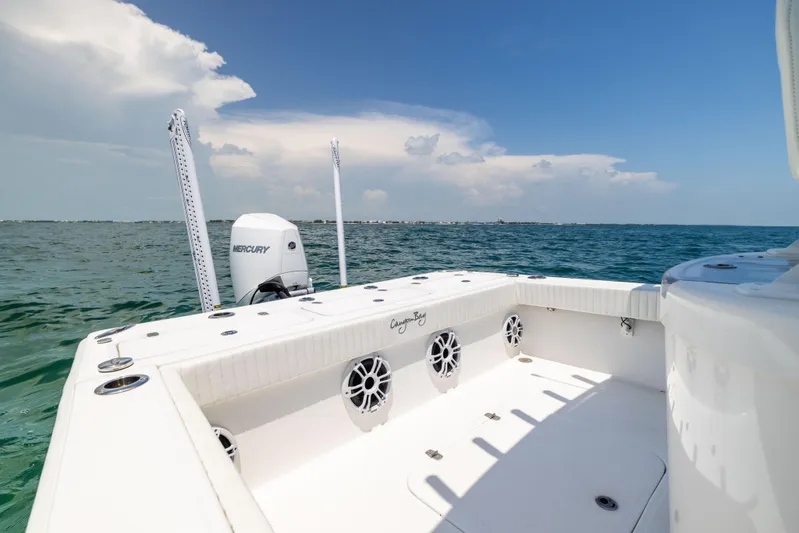  Yacht Photos Pics 2023 Canyon Bay 28h boat on open water, featuring spacious deck and Mercury engine.