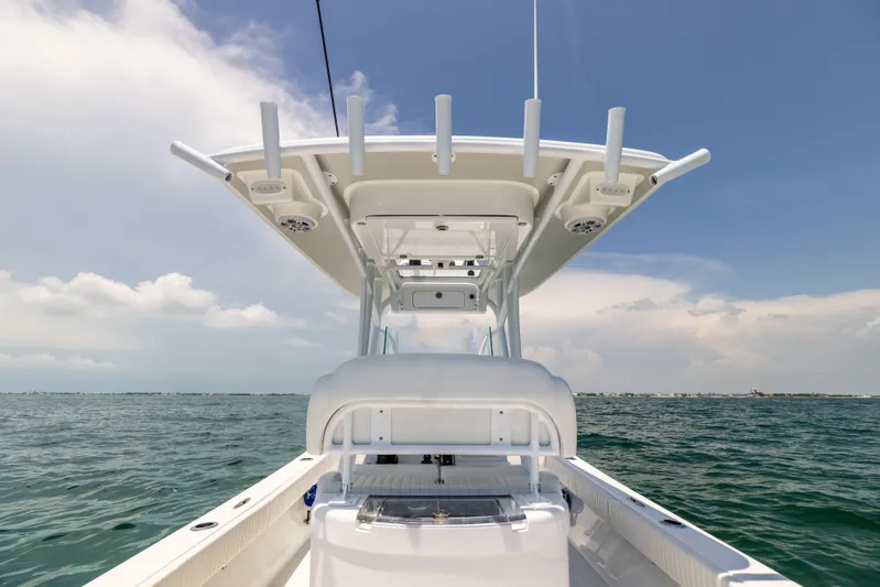  Yacht Photos Pics 2023 Canyon Bay 28h boat on open water under clear sky.