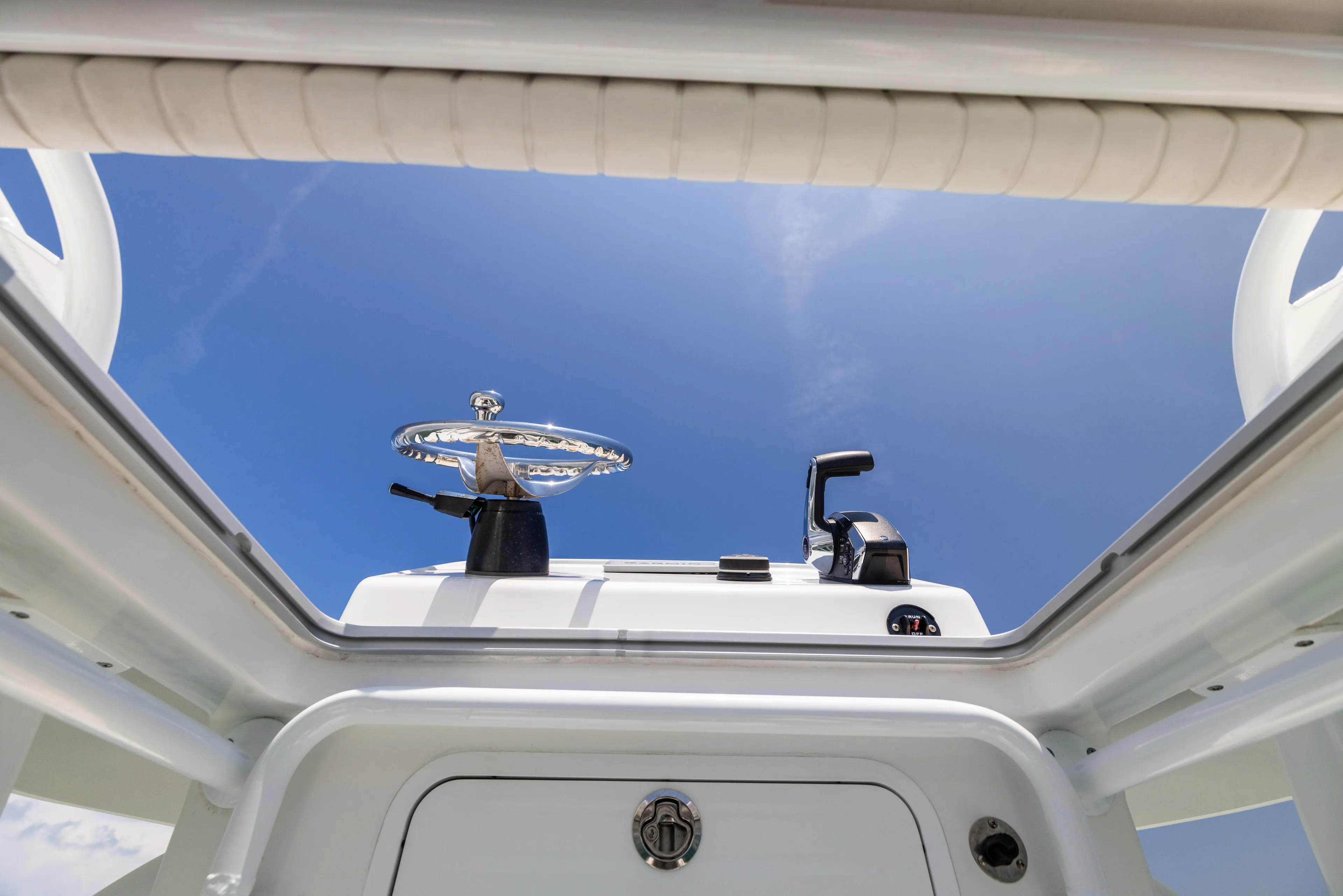  Yacht Photos Pics Canyon Bay 28h boat helm view against clear blue sky, 2023 model.