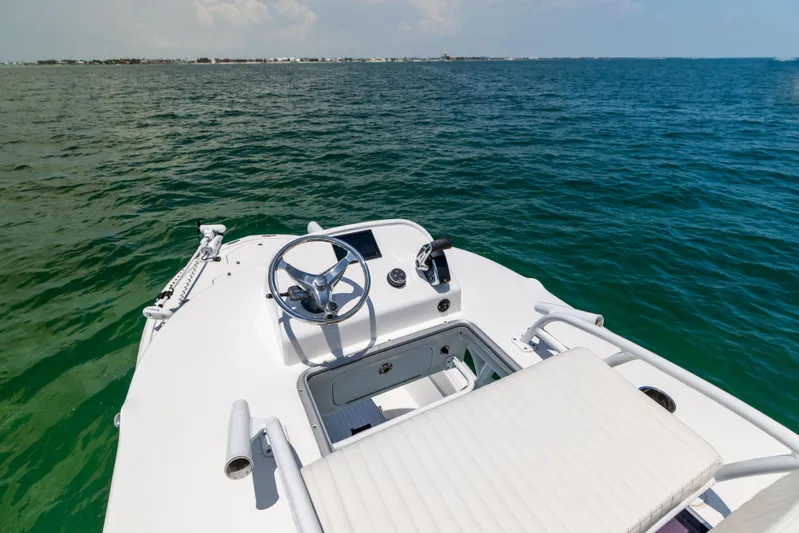  Yacht Photos Pics 2023 Canyon Bay 28h boat on open water, featuring sleek design and modern controls.