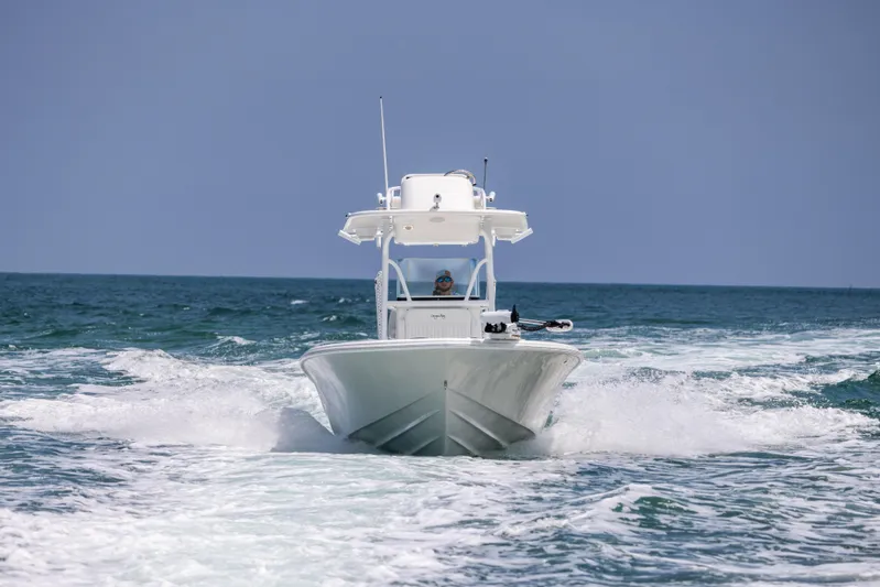  Yacht Photos Pics 2023 Canyon Bay 28h boat cruising on open ocean waters.