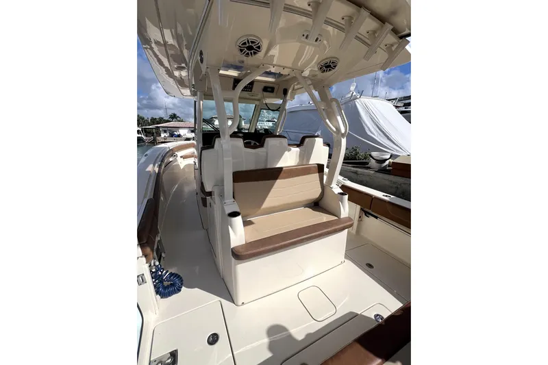 Bachita Yacht Photos Pics 2023 Scout 355 LXF boat interior with seating and overhead speakers.