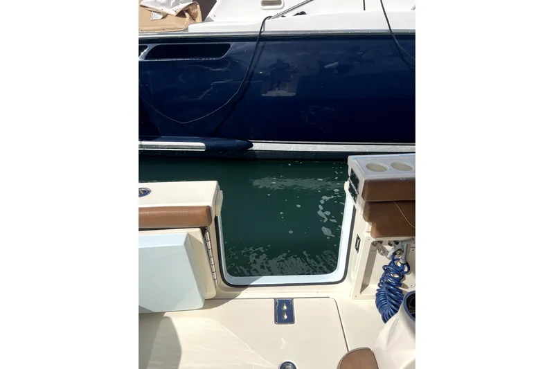 Bachita Yacht Photos Pics 2023 Scout 355 LXF boat interior with water view and docked vessel.