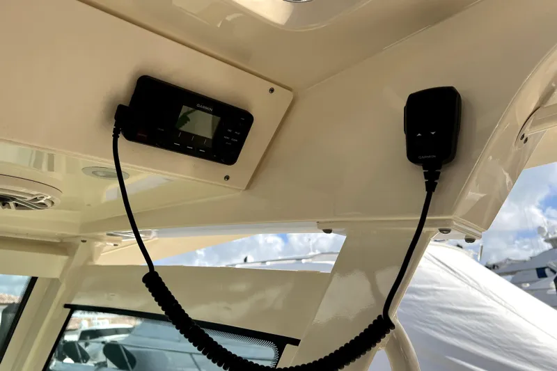 Bachita Yacht Photos Pics 2023 Scout 355 LXF boat interior with Garmin marine electronics and communication equipment.