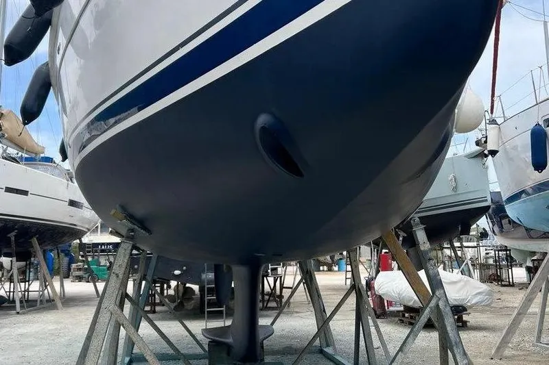 1754 Yacht Photos Pics 2004 Hunter 426 Owners Version sailboat on stands in a boatyard.