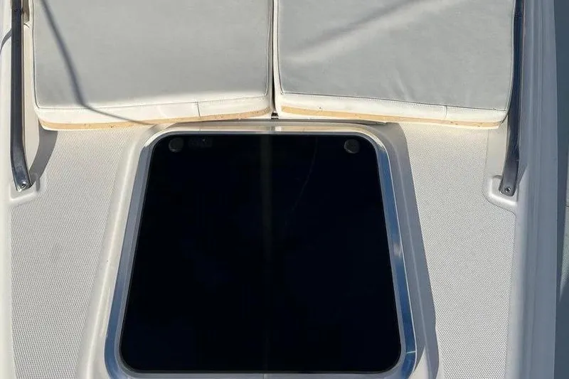 1754 Yacht Photos Pics Deck view of 2004 Hunter 426 Owners Version sailboat with cushioned seating.