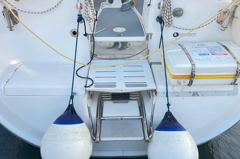 1754 Yacht Photos Pics Rear view of 2004 Hunter 426 Owners Version yacht with fenders and safety equipment.