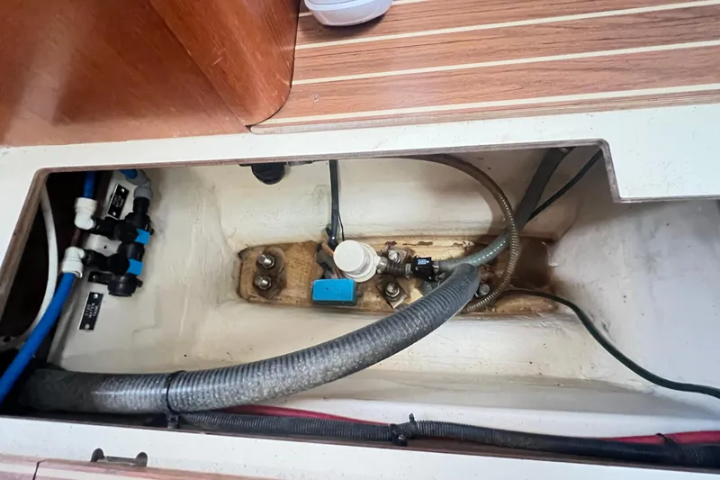 1754 Yacht Photos Pics Engine compartment of a 2004 Hunter 426 Owners Version sailboat, showing hoses and fittings.