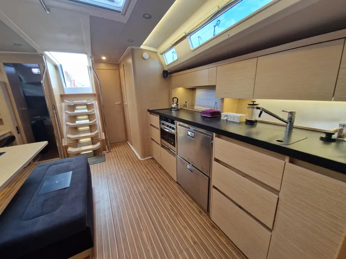  Yacht Photos Pics Modern kitchen interior of 2020 Hanse 508 yacht with sleek cabinetry and appliances.