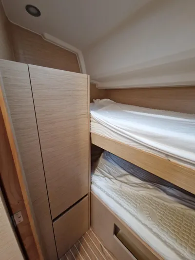  Yacht Photos Pics 2020 Hanse 508 yacht interior with wooden bunk beds and modern design.