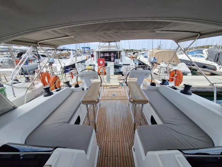  Yacht Photos Pics 2020 Hanse 508 yacht interior with spacious seating and wooden deck at marina.