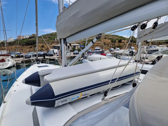  Yacht Photos Pics 2020 Hanse 508 yacht with inflatable dinghy on deck, docked at marina.