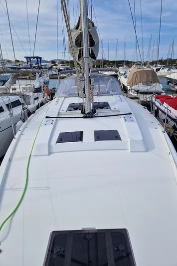 Yacht Photos Pics 2020 Hanse 508 yacht docked in a marina, surrounded by other boats.