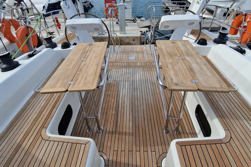  Yacht Photos Pics Teak deck of 2020 Hanse 508 yacht with foldable tables and seating.