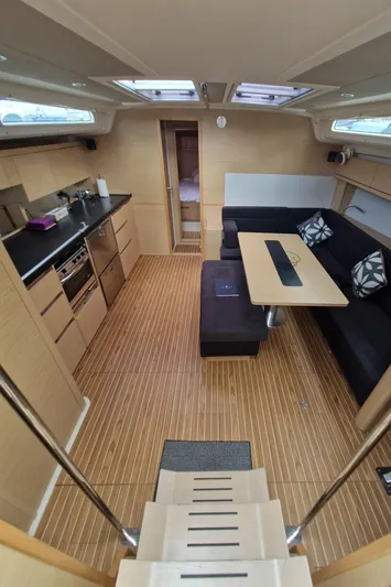  Yacht Photos Pics 2020 Hanse 508 yacht interior with modern kitchen and cozy seating area.