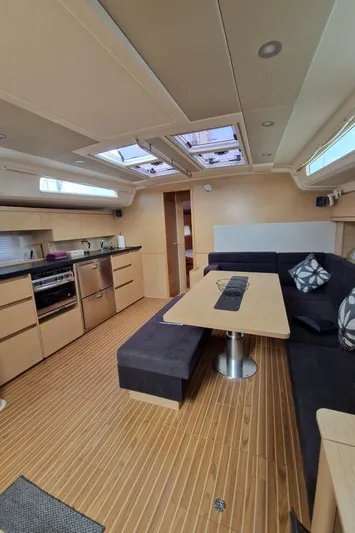  Yacht Photos Pics Interior of 2020 Hanse 508 yacht with modern kitchen and cozy seating area.