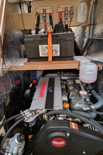  Yacht Photos Pics Engine compartment of a 2020 Hanse 508 yacht, featuring a Yanmar engine and battery setup.