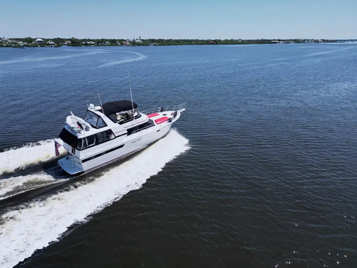 Radiant Yacht Photos Pics 1991 Californian 48 Sundeck Motor Yacht cruising on open water.